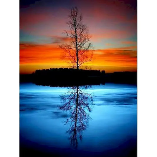 Paint by numbers kit of a lone bare tree perfectly reflected in a still blue lake at twilight, 30x40cm
