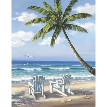 Paint by numbers kit of a tropical beach with a leaning palm tree, two white chairs and turquoise ocean water, 30x40cm