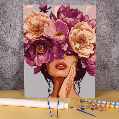 Paint by numbers kit of a woman with her face hidden by a large purple and pink peony flower crown, 30x40cm