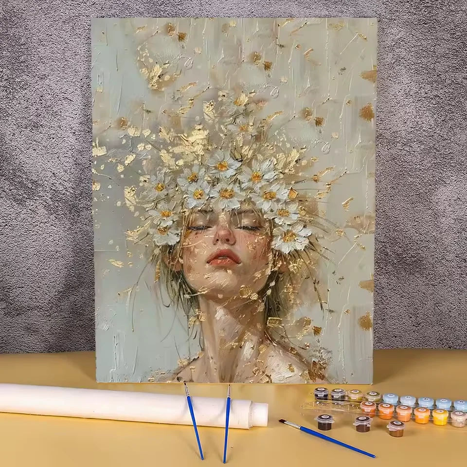 Paint by numbers kit of a serene woman with a white daisy and gold leaf crown in a soft textured style, 30x40cm